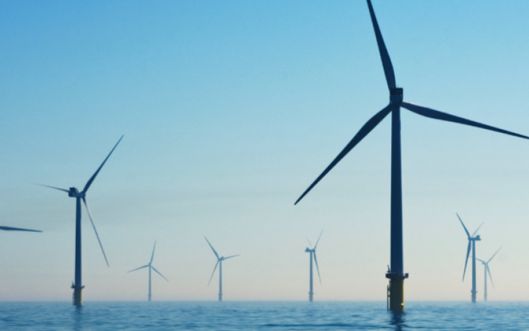 A wide shot of an offshore wind farm
